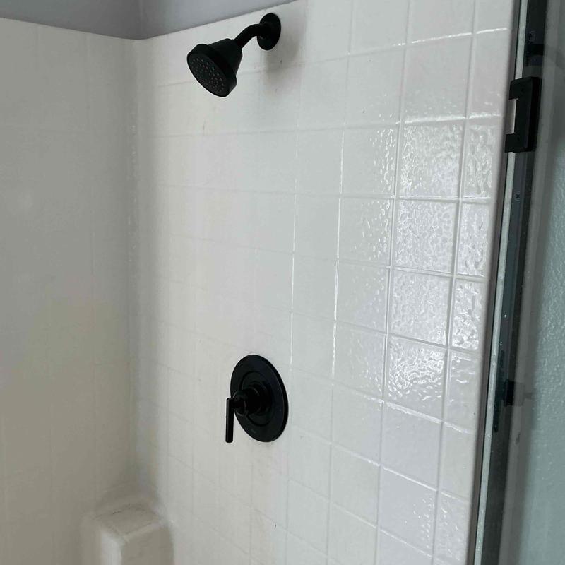 Moen black shower trim and showerhead installed