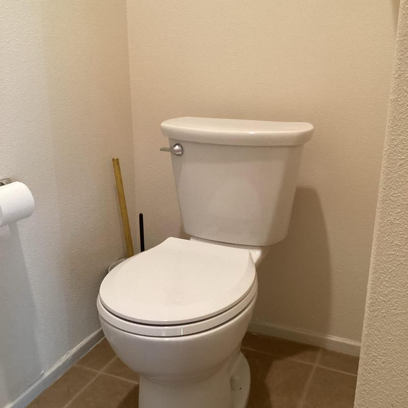 Toilet replacement in residential bathroom corner