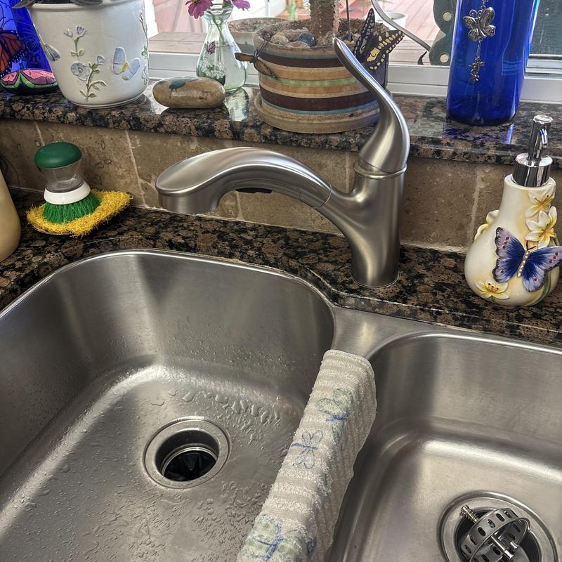 Kitchen sink faucet with granite countertop and decorations