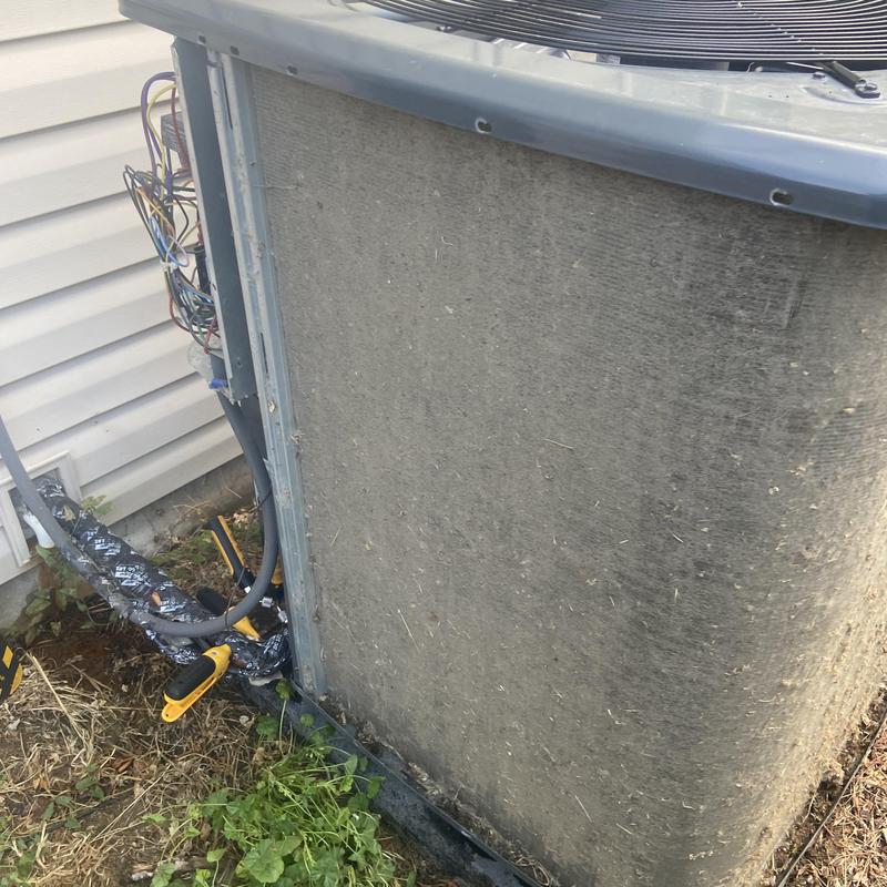 Dirty outdoor air conditioner condenser coil and wiring Dirty outdoor air conditioner condenser coil and wiring
