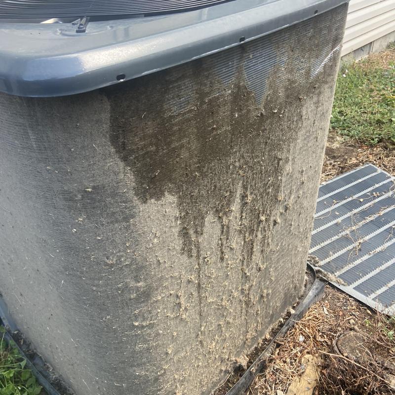 Outdoor air conditioner condenser with heavy dirt buildup Outdoor air conditioner condenser with heavy dirt buildup