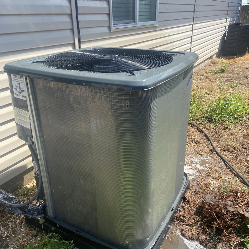 Outdoor air conditioner condenser with dirt buildup Outdoor air conditioner condenser with dirt buildup