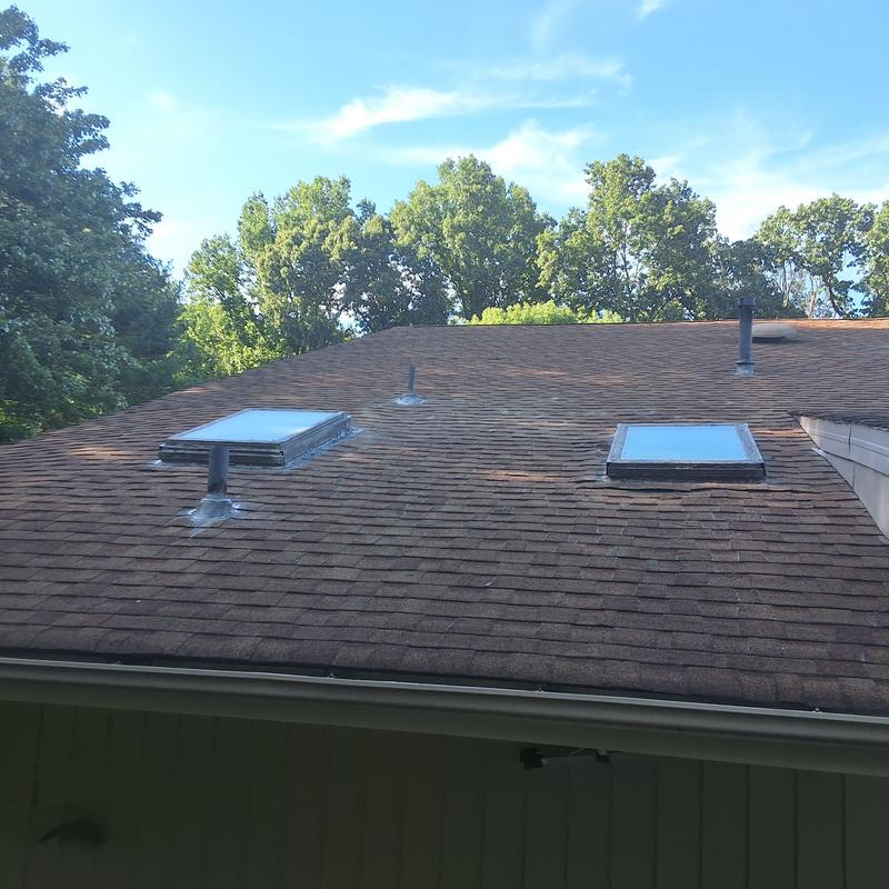 Skylights on aged shingle roof with leak points