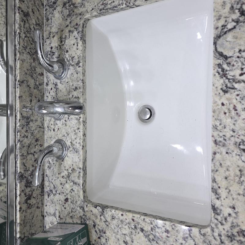 Lavatory sink with chrome faucet on granite countertop Lavatory sink with chrome faucet on granite countertop