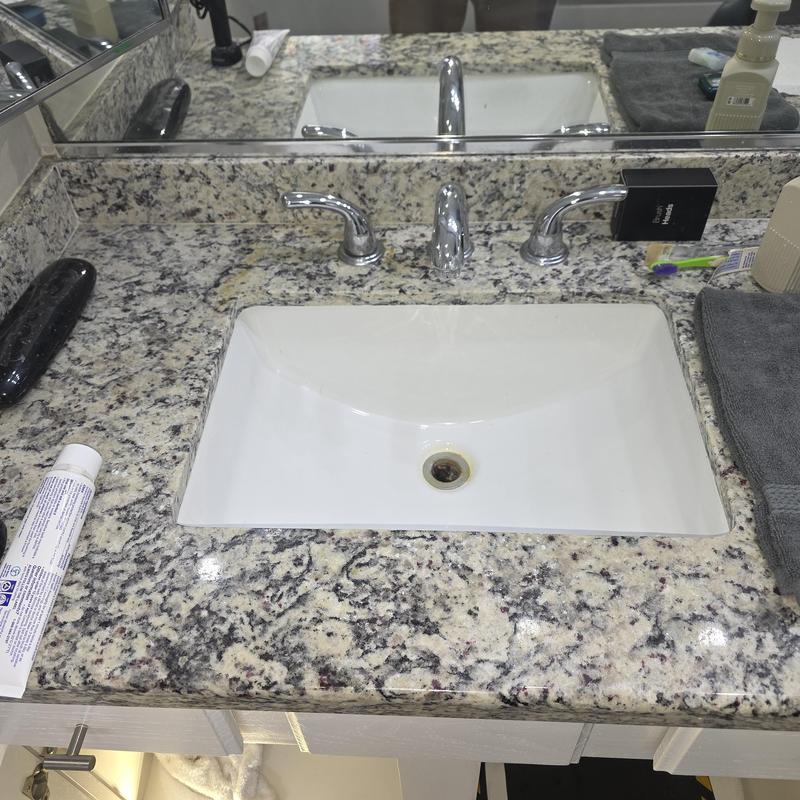 Bathroom lavatory sink with granite countertop and chrome faucet Bathroom lavatory sink with granite countertop and chrome faucet