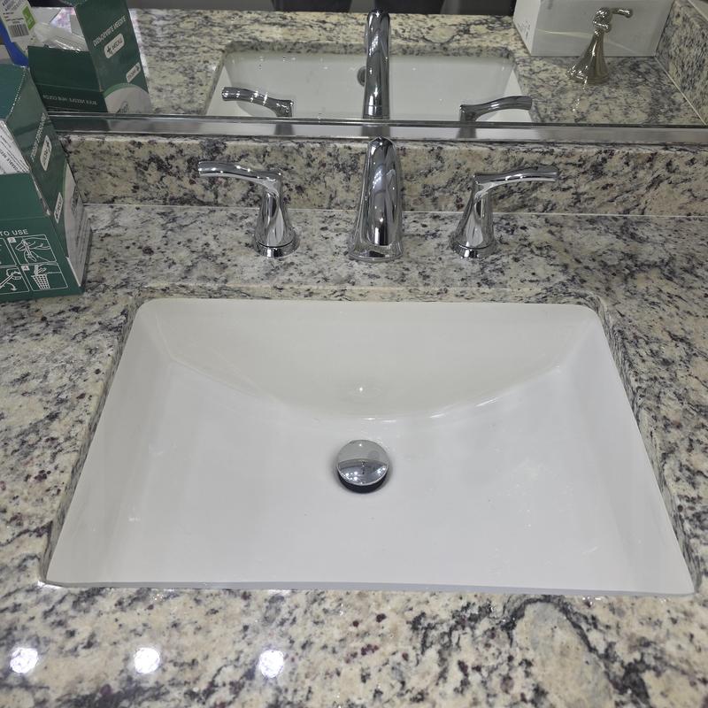 Bathroom lavatory sink with chrome faucet on granite countertop Bathroom lavatory sink with chrome faucet on granite countertop