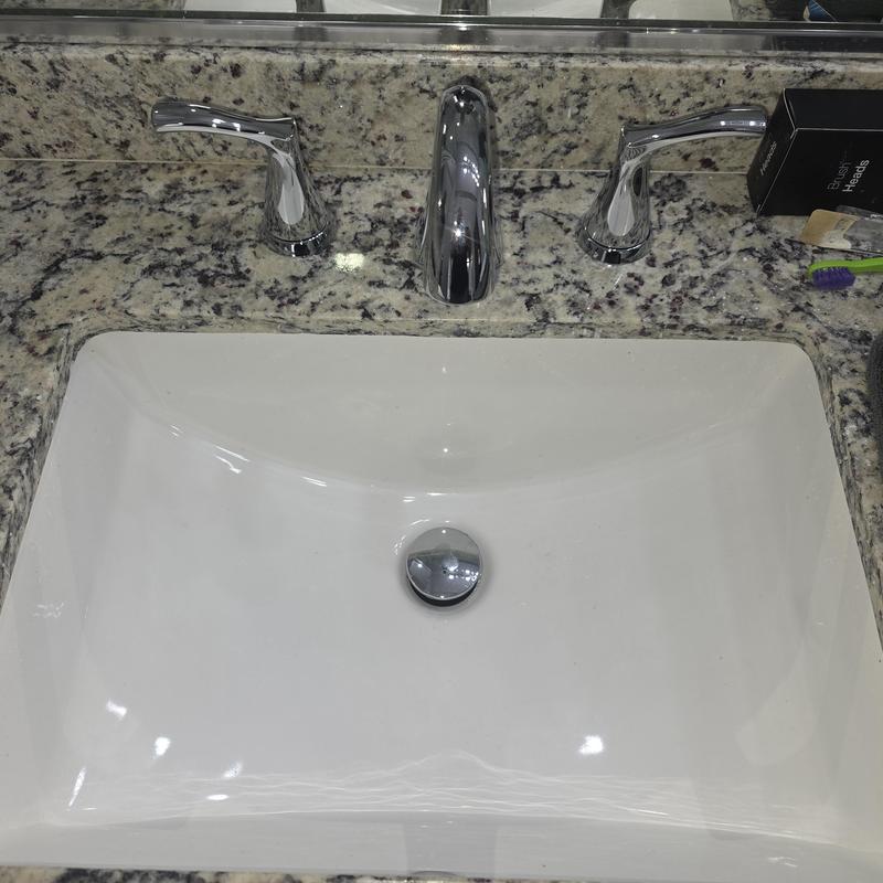 Bathroom sink and faucet installation on granite countertop Bathroom sink and faucet installation on granite countertop