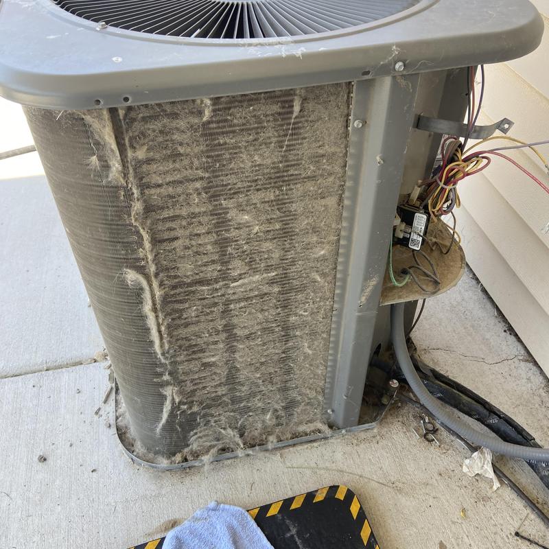 Outdoor air conditioner condenser with dirty coils and wiring Outdoor air conditioner condenser with dirty coils and wiring