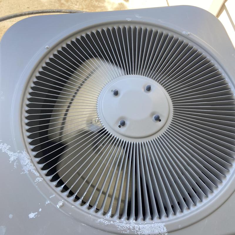Outdoor air conditioner condenser fan and grill close-up Outdoor air conditioner condenser fan and grill close-up