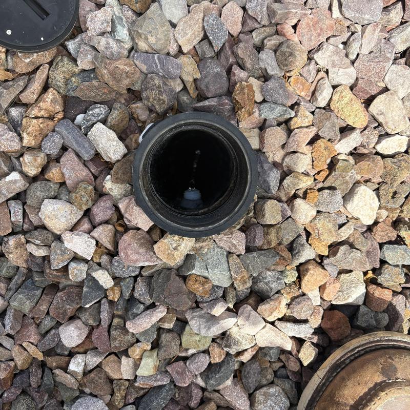 Clack head seal stack surrounded by gravel stones