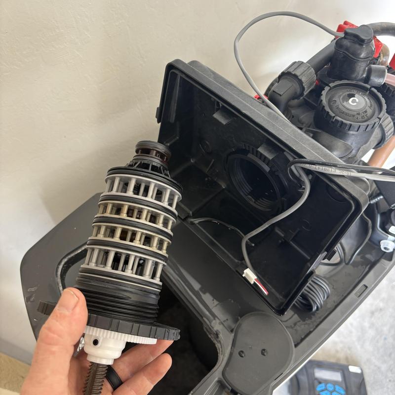 Clack head seal stack removed from valve body