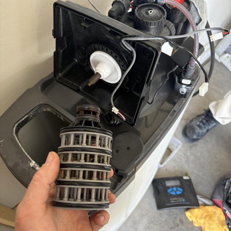 Clack head seal stack replacement parts in hand