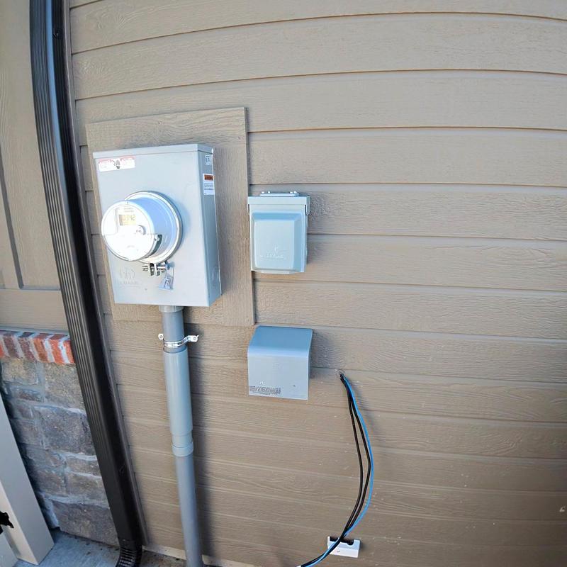 EV charging receptacle and electrical meter installation outdoors EV charging receptacle and electrical meter installation outdoors