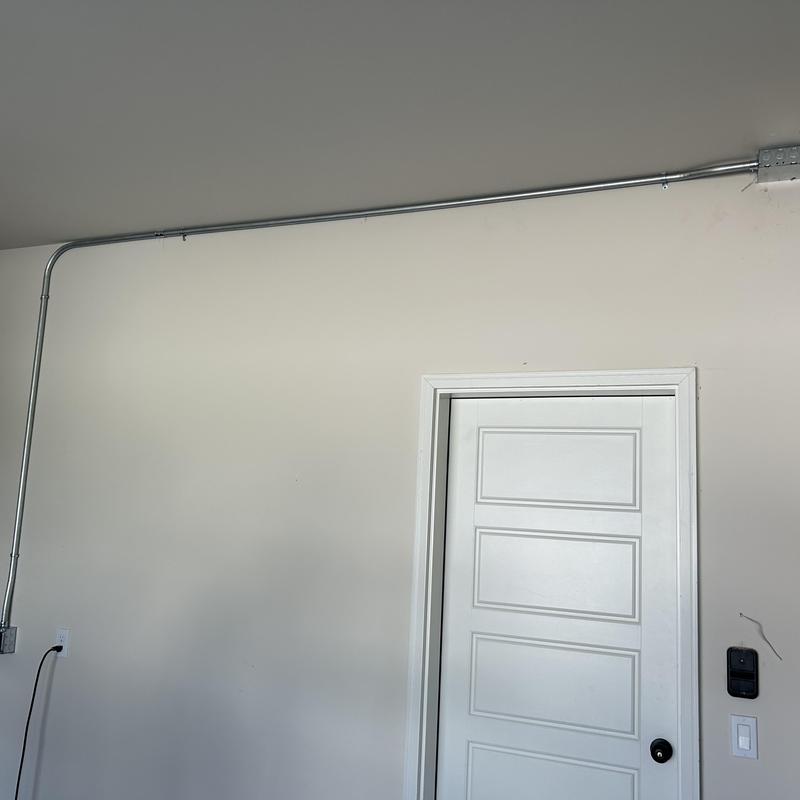 EV charging receptacle conduit and wall door setup EV charging receptacle conduit and wall door setup