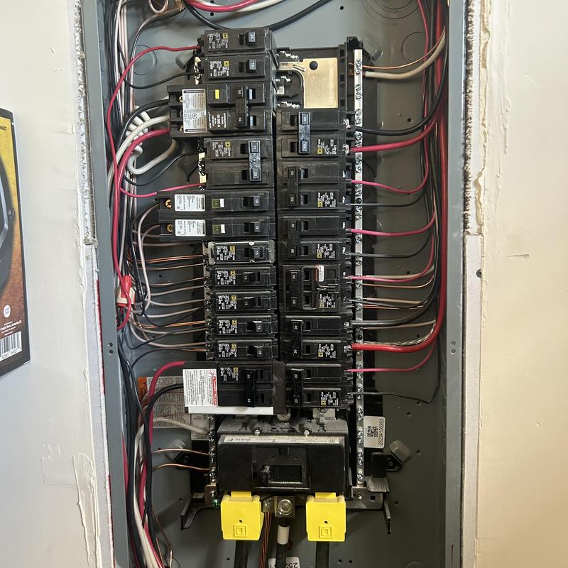 Electrical breaker panel with generator interlock installation Electrical breaker panel with generator interlock installation