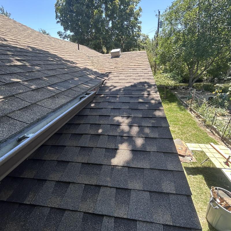 GAF HDZ shingle roof with nearby gutter and garden GAF HDZ shingle roof with nearby gutter and garden