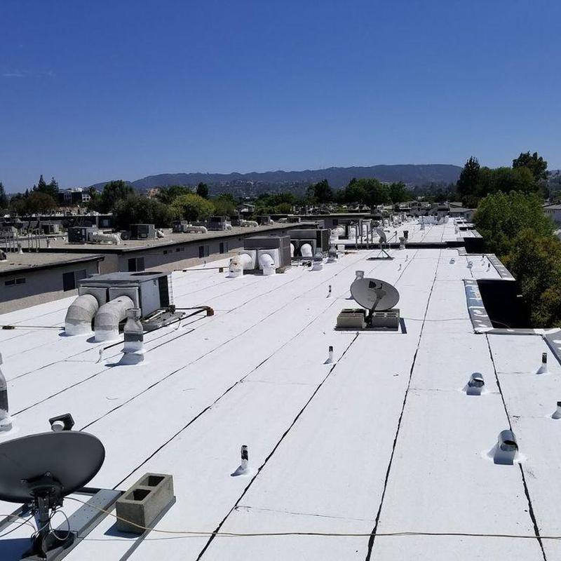 TPO commercial roof with satellite dishes and vents TPO commercial roof with satellite dishes and vents