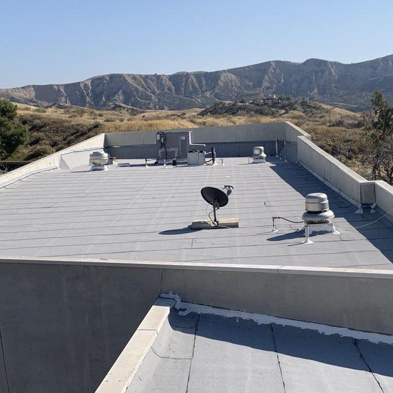 Commercial flat roof with ventilation and satellite systems Commercial flat roof with ventilation and satellite systems