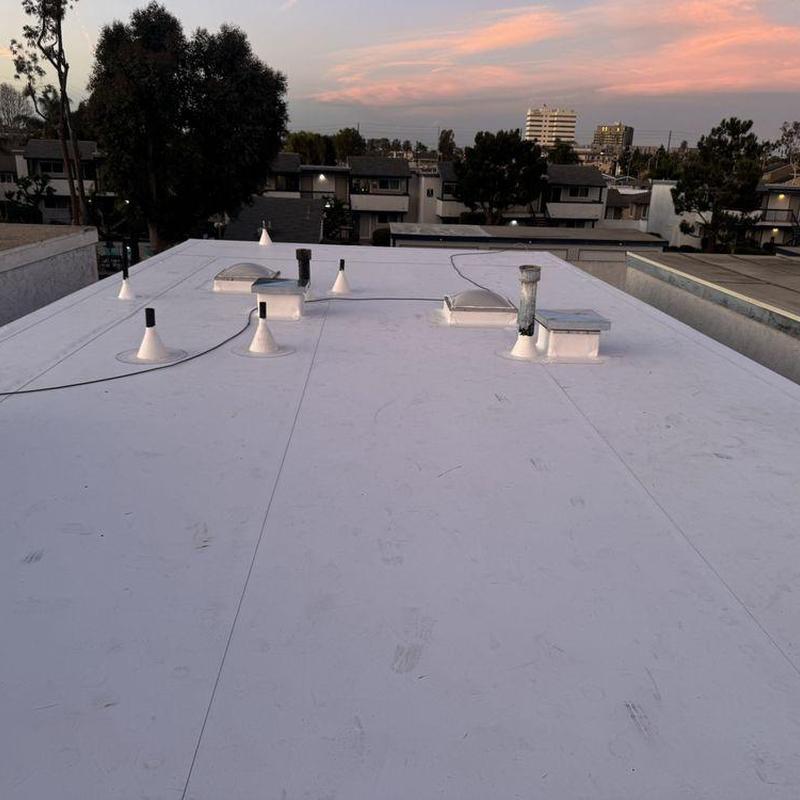 Commercial flat roof with vents and skylights Commercial flat roof with vents and skylights