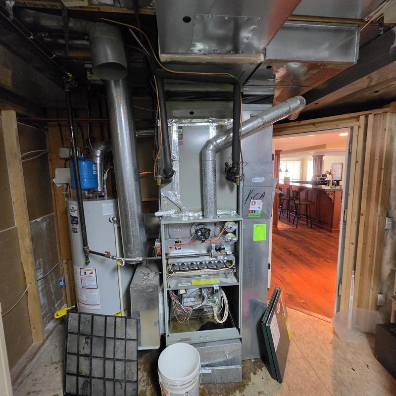 Indoor HVAC unit condensate drain repiping and safety installed