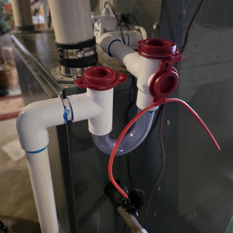 Condensate drain line with new piping and safety device
