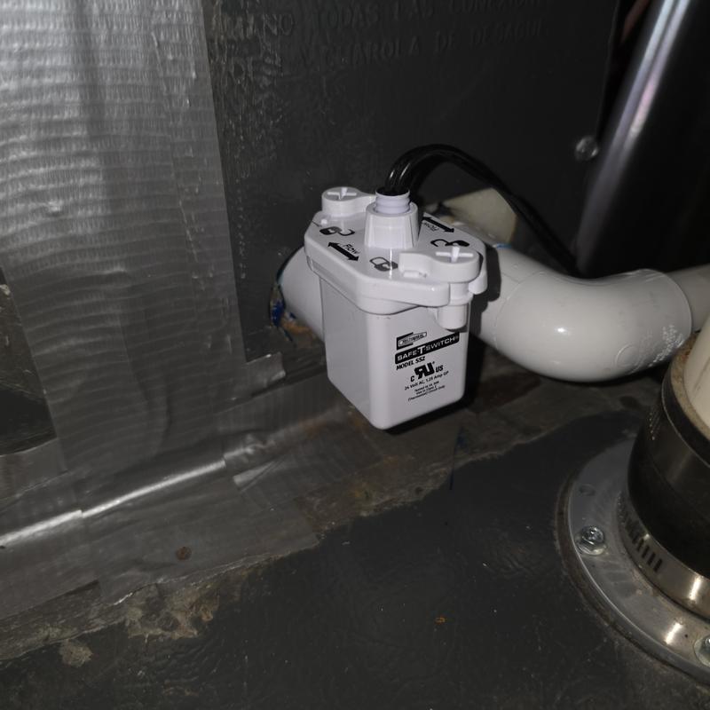 Condensate safety switch installed on drain pipe