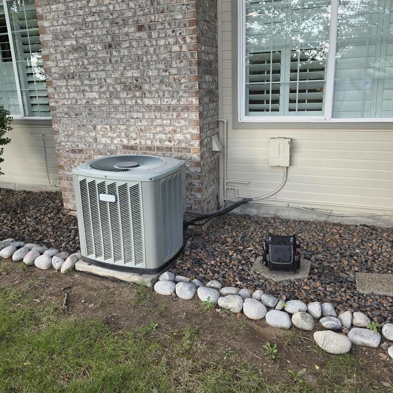 American Standard air conditioner condenser unit outdoors