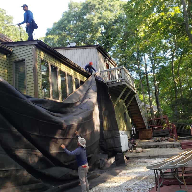 Ice and water shield installation on roof in Gales Ferry