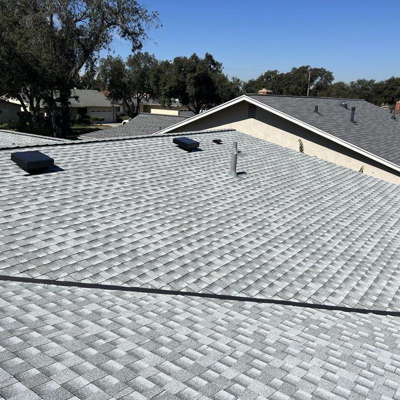 New shingle roof installation on residential house New shingle roof installation on residential house