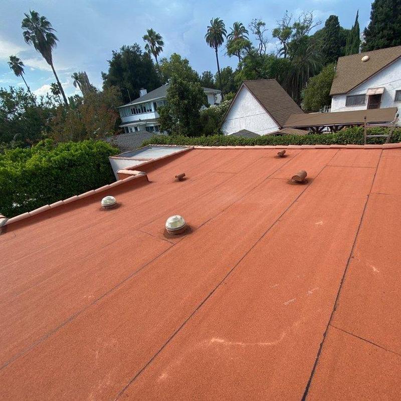 Flat roof with vents and skylights in a residential area Flat roof with vents and skylights in a residential area