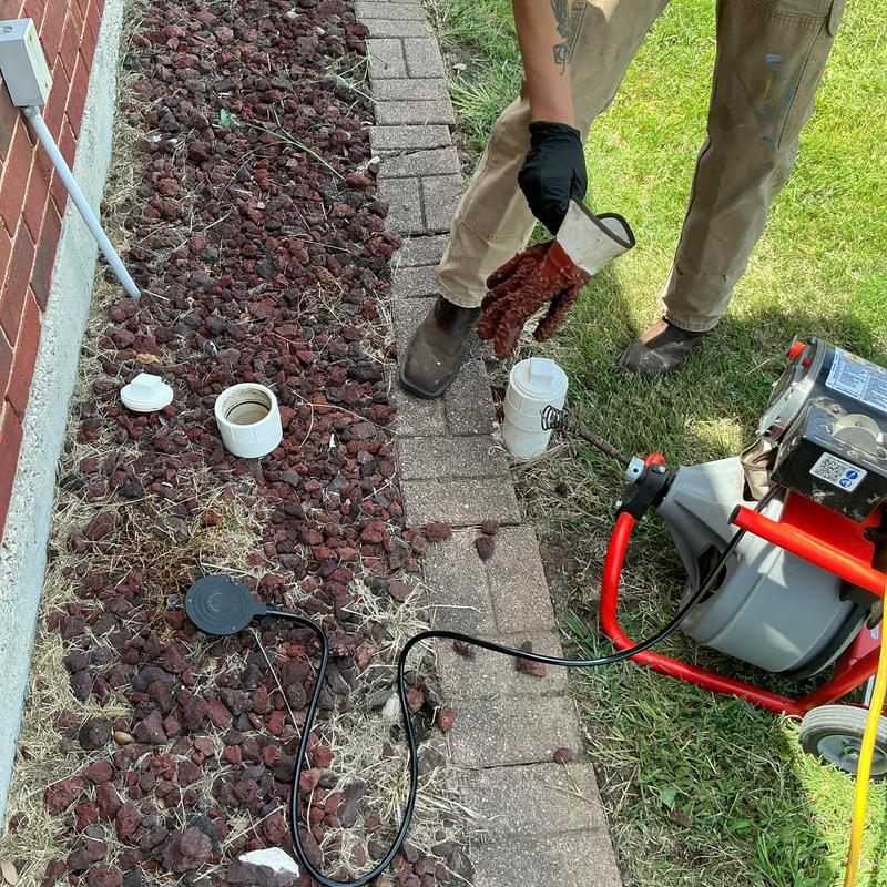 Sewer cleanout with cable machine clearing stoppage Sewer cleanout with cable machine clearing stoppage
