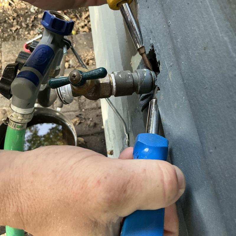Hose bib installation with male adapter and screwdrivers Hose bib installation with male adapter and screwdrivers
