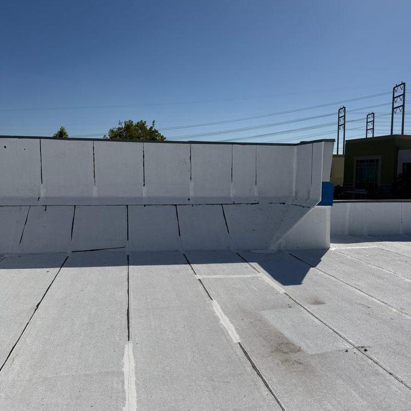 Flat roofing membrane with wall flashing and seams Flat roofing membrane with wall flashing and seams