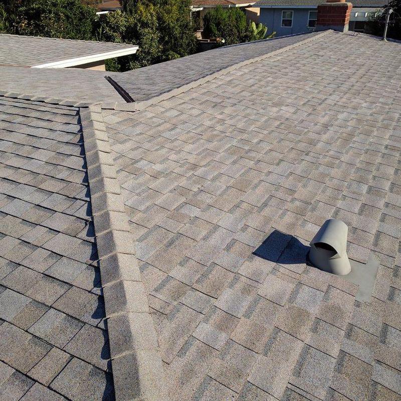Asphalt shingle roof with vent pipe installation Asphalt shingle roof with vent pipe installation
