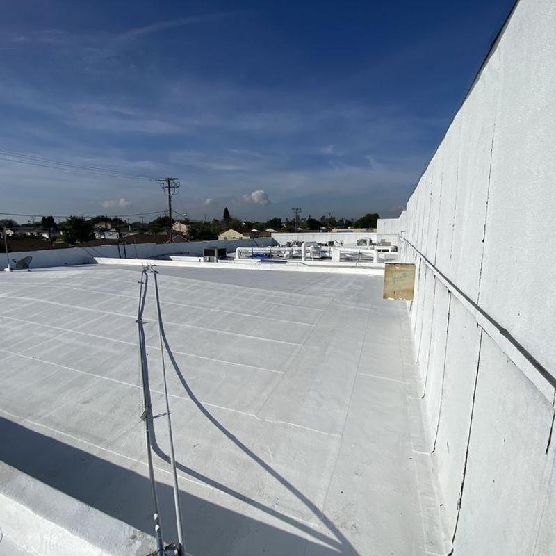 Flat roofing system with white coating in Cerritos, CA Flat roofing system with white coating in Cerritos, CA