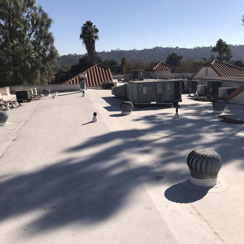 Commercial flat roofing with HVAC units and vents Commercial flat roofing with HVAC units and vents