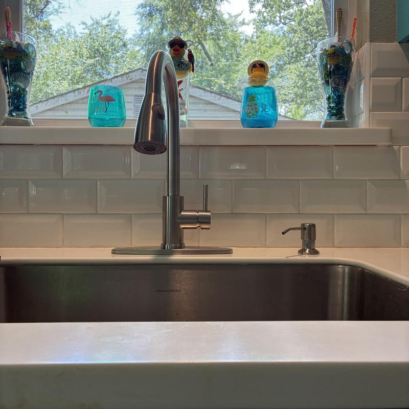 Modern kitchen sink faucet with soap dispenser installed Modern kitchen sink faucet with soap dispenser installed