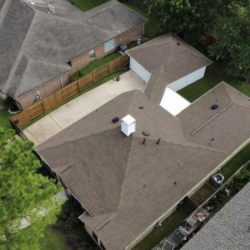 Residential asphalt shingle roof replacement overhead view