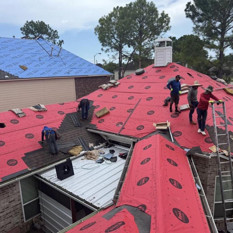 Synthetic roofing underlayment installation on residential roof