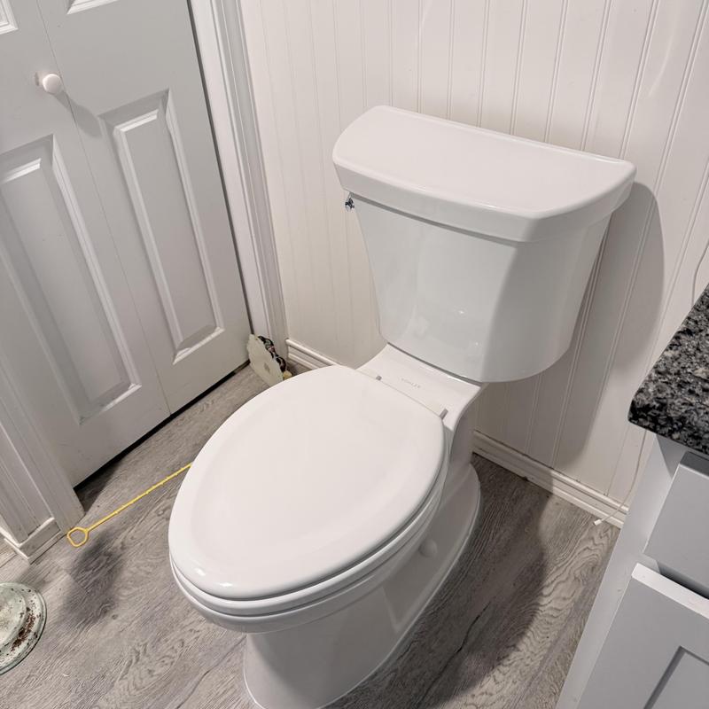 White toilet installed in residential bathroom