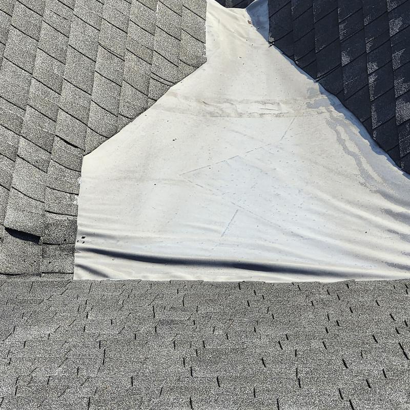 Roof flashing under shingle roofing inspection