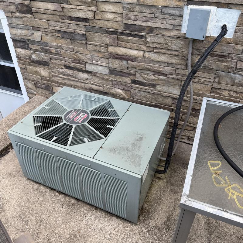Rheem 20+ year old AC condenser unit outdoors Rheem 20+ year old AC condenser unit outdoors