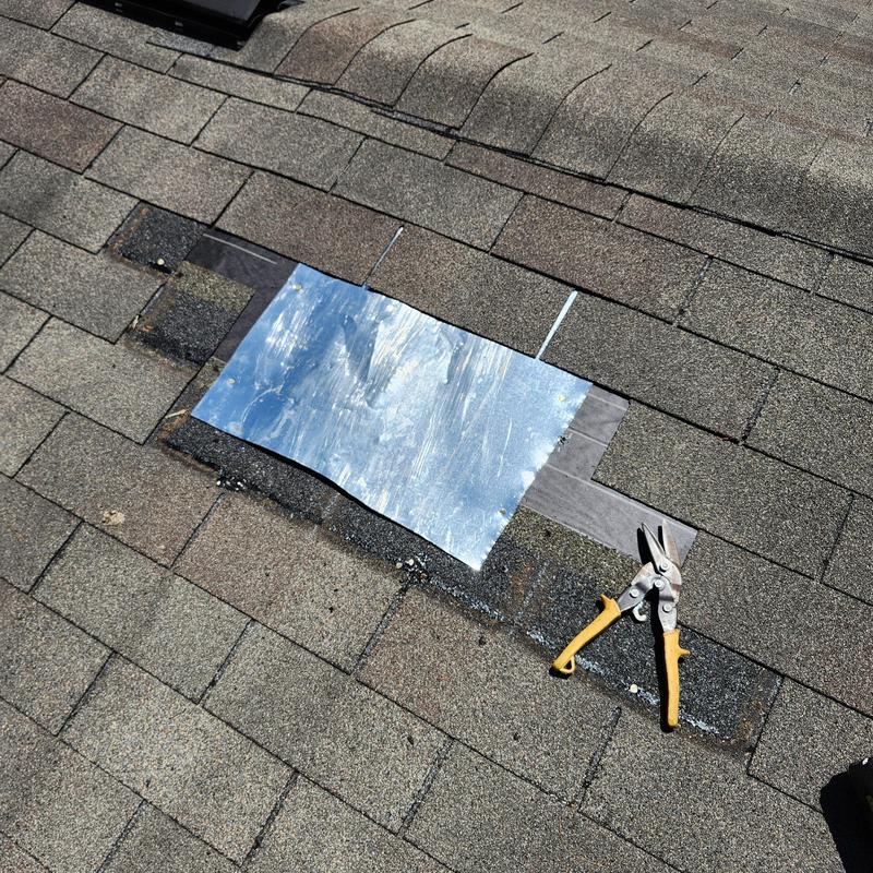 Shingled roof patch with metal flashing and tool