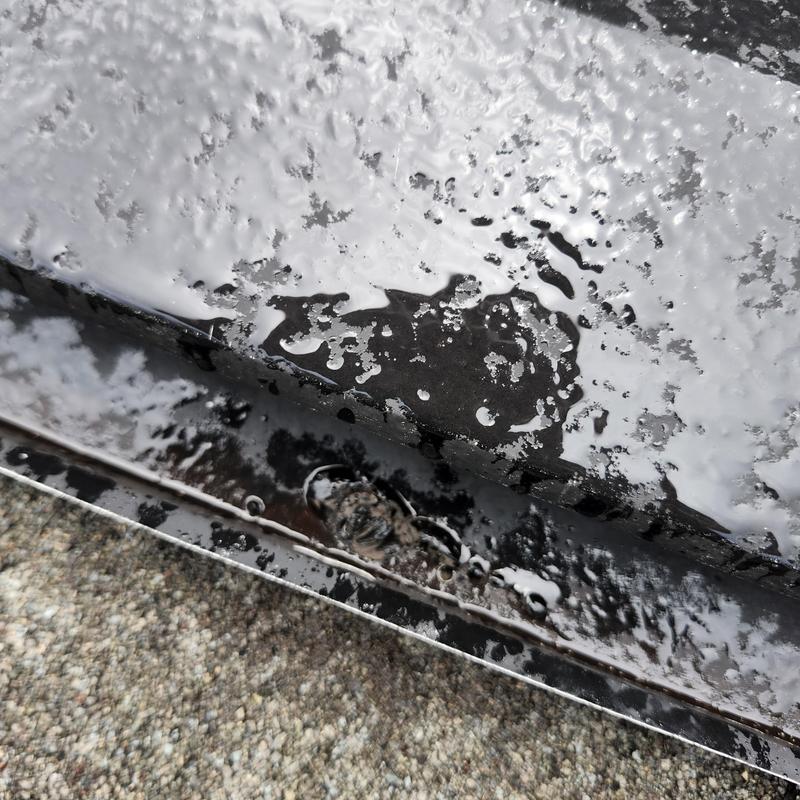 Shingled roof vent boot with sealing damage and rust
