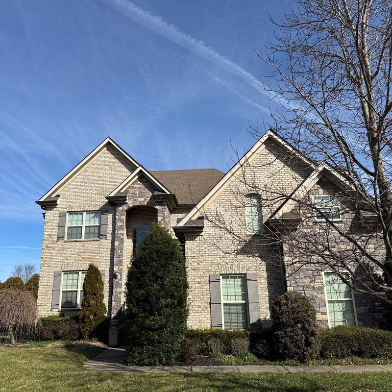 Roof shingles and flashing with hail damage on home