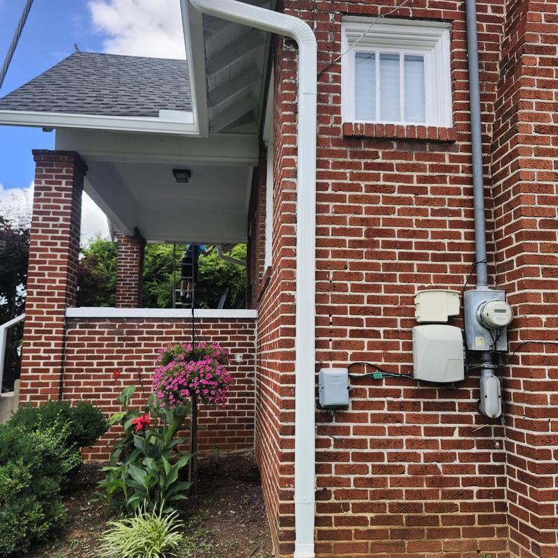 New larger gutter and downspout with upgraded hanger