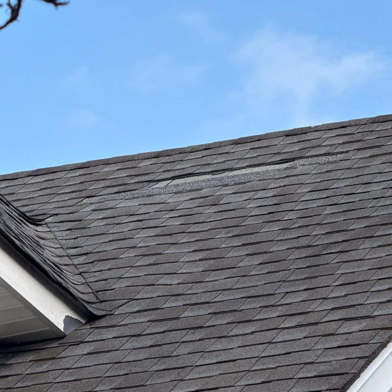 Asphalt shingles with hail damage and roof penetrations