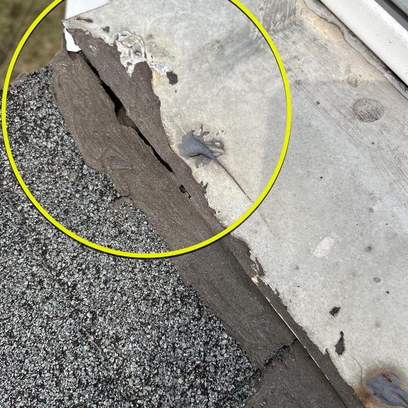 Roof flashing with visible cracking and wear damage