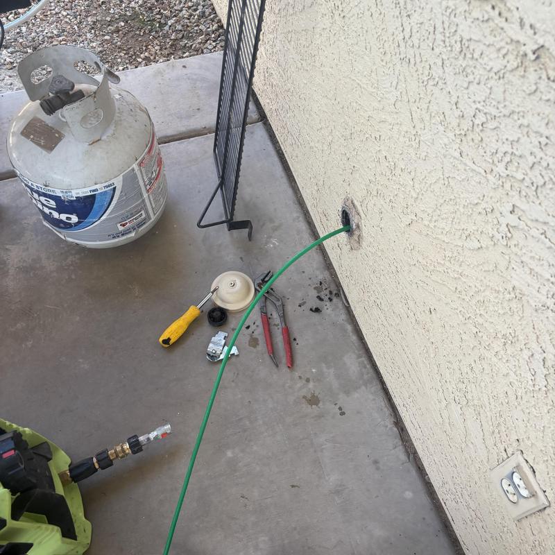 Kitchen line cleanout hydro jetting on exterior wall