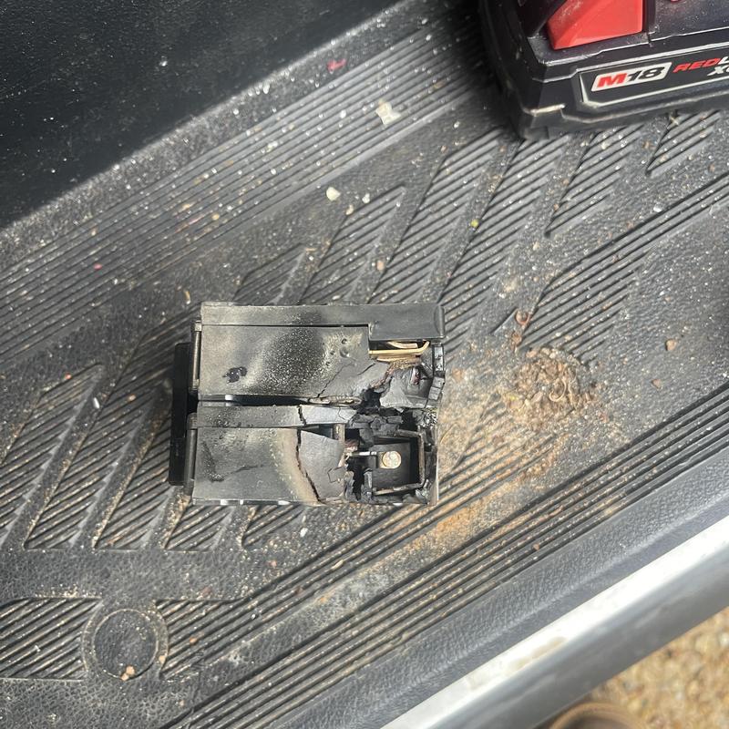 Burnt electrical breaker removed from panel board